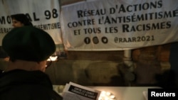 FILE — People attend a demonstration against antisemitism and xenophobia organized by the Action Network against Anti-Semitism and All Racisms and the Memorial98 associations, in Paris, France, Nov. 9, 2023.