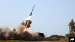 (FILE) A missile is launched during a drill in southern Iran, in this photo released by the Iranian army's website on Jan. 19, 2024. European intelligence sources say Russians are being trained in Iran to use a close-range ballistic missile system.