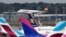 FILE - An Airbus A320 of Condor Airlines lands at the airport in Hamburg, Germany, Sept. 24, 2019. Air traffic resumed at the hub Monday after an emailed threat against an Iranian plane that had landed there shortly after noon.