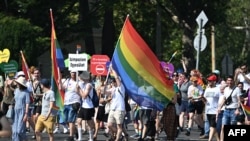 People take part in the LGBTQ+ Pride Parade in Budapest, Hungary, on July 15, 2023.
