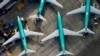 FILE - An aerial photo shows Boeing 737 Max airplanes parked on the tarmac at the Boeing Factory in Renton, Washington, March 21, 2019. 