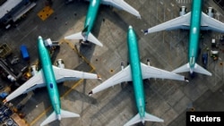 FILE - An aerial photo shows Boeing 737 Max airplanes parked on the tarmac at the Boeing Factory in Renton, Washington, March 21, 2019. 