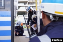 Autonomous Rail Transit being inspected before test runs by Transportation Ministry technicians. (Courtesy Indonesian Transportation Ministry)