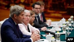 U.S. Climate Envoy John Kerry (L) attends a meeting with Director of the Office of the Foreign Affairs Commission of the Communist Party of China's Central Committee Wang Yi at the Great Hall of the People in Beijing, China, July 18, 2023. 
