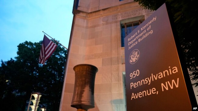 A sign at the Department of Justice is pictured late on June 8, 2023, in Washington. Former President Donald Trump said Thursday that he'd been indicted on charges of mishandling classified documents at his Florida estate.