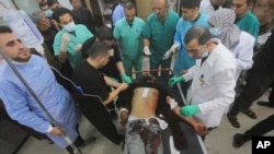 A Palestinian wounded in the Israeli bombardment of the Gaza Strip is treated at a hospital in Rafah on Jan. 16, 2024.