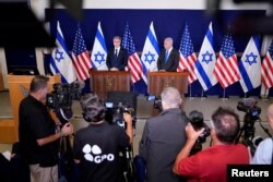 U.S. Secretary of State Antony Blinken and Israel’s Prime Minister Benjamin Netanyahu make statements to the media inside The Kirya, which houses the Israeli Ministry of Defense, after their meeting in Tel Aviv, Israel, Oct. 12, 2023.