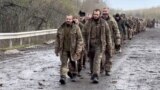FILE - Ukrainian prisoners of war are seen during a swap for captured Russian soldiers at an undisclosed location in Ukraine, in this screengrab from a handout video released April 16, 2023. (Coordination Headquarters for the Treatment of Prisoners of War/Handout via Reuters)