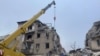 This handout picture taken and released Nov. 16, 2023, by Ukrainian Emergency Service shows rescuers clearing debris of a residential building damaged after a Russian strike in Selydove, Donetsk region.