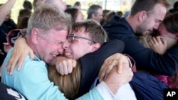 An Argentinian who was caught in the latest Israel-Hamas war is greeted by relatives as he arrives to the airport Buenos Aires, Argentina.