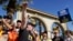 SAG-AFTRA chief negotiator Duncan Crabtree-Ireland, left, rallies striking actors in outside Paramount Pictures studio, Nov. 3, 2023, in Los Angeles. 
