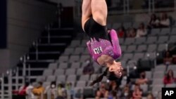 Chellsie Memmel competes in the vault at age 33 during the U.S. Gymnastics Championships in Fort Worth, Texas, June 4, 2021. Seeing Memmel compete inspired Jen Castellano to return to gymnastics as an adult.