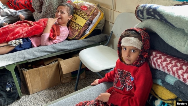 Wounded children take shelter in a school near Rafah in the southern Gaza Strip, Dec. 7, 2023.