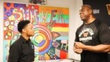 Jordan Williams, a student in the Deanwood Radio Broadcast Youth Journalism Program, interviews basketball legend Magic Johnson in Washington, D.C. (Courtesy Photo) 