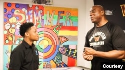 Jordan Williams, a student in the Deanwood Radio Broadcast Youth Journalism Program, interviews basketball legend Magic Johnson in Washington, D.C. (Courtesy Photo) 