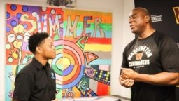 Jordan Williams, a student in the Deanwood Radio Broadcast Youth Journalism Program, interviews basketball legend Magic Johnson in Washington, D.C. (Courtesy Photo) 