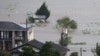 Farmland is submerged due to floods caused by heavy rains from Typhoon Shanshan in Yufu, Oita Prefecture, southwestern Japan, Aug. 29, 2024, in this photo taken by Kyodo. 