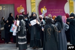 FILE - Afghan women stage a protest for their rights at a beauty salon in the Shahr-e-Naw area of Kabul on July 19, 2023. Afghanistan's Taliban has ordered beauty shops across the country to close. (Photo by AFP)
