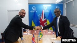 British Home Secretary James Cleverly and Rwandan Minister of Foreign Affairs Vincent Biruta hold a bilateral meeting after signing a new treaty, in Kigali, Rwanda, Dec. 5, 2023. 