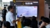 A TV screen shows a file image of North Korea's missile launch during a news program at the Seoul Railway Station in Seoul, South Korea, July 22, 2023.