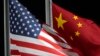 FILE - The U.S. and Chinese flags wave ahead of the 2022 Winter Olympics, in Zhangjiakou, China, Feb. 2, 2022. Beijing on Aug. 25, 2024, protested U.S. sanctions on firms Washington says enable Moscow to continue its Ukraine offensive.