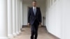 President Barack Obama walks along the colonnade of the White House to the residence from the Oval Office hours before giving his the State Of The Union address, in Washington, Jan. 12, 2016.