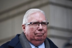 FILE - Jerome Corsi listens during a news conference outside the federal courthouse in Washington, Jan. 3, 2019.