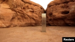 A metal monolith is seen in Red Rock Desert, Utah, U.S., November 25, 2020, in this still image obtained from a social media video. (@davidsurber_ via REUTERS)