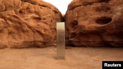 A metal monolith is seen in Red Rock Desert, Utah, U.S., November 25, 2020, in this still image obtained from a social media video. @davidsurber_ via REUTERS