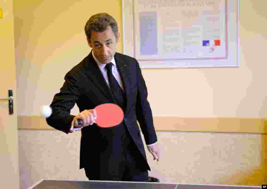 April 14: France's President Nicolas Sarkozy plays ping pong as he visits a reintegration school (ERS) in Bagnieres de Luchon. (Reuters)