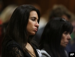 Kim Myers, a friend of the late Reeva Steenkamp, listens to a witness testify at the murder trial of Oscar Pistorius, in Pretoria, South Africa, on May 6, 2014