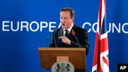 British Prime Minister David Cameron speaks during a media conference after an EU summit at the EU Council building in Brussels, on Friday, Oct. 24, 2014.