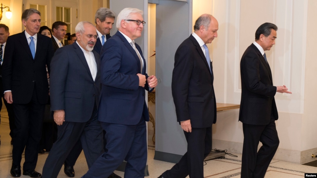FILE - Iranian Foreign Minister Mohammad Javad Zarif (2nd-L) is seen walking with his counterparts from the P5+1 group in Vienna, Austria, Nov. 24, 2014.