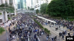 FILE - An estimated 800,000 protesters flock to the streets of Hong Kong to mark the six-month anniversary of the anti-government movement sparked by a controversial extradition law, Dec. 8, 2019.