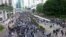 An estimated 800,000 protesters flock to the streets of Hong Kong to mark the six-month anniversary of the anti-government movement sparked by a controversial extradition law, Dec. 8, 2019.