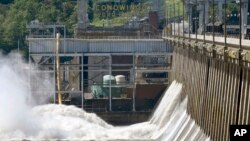 Officials once counted on Conowingo Dam to block large amounts of sediment in the Susquehanna from reaching Chesapeake Bay, the nation's largest estuary, but the reservoir behind the dam has filled with sediment far sooner than expected. (AP Photo/Steve Ruark)