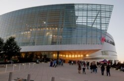 FILE - People stream into the BOK Center, site of President Donald Trump's Saturday rally, in Tulsa, Oklahoma, Oct. 12, 2017.