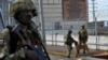Russian servicemen patroling near the Kakhovka Hydroelectric Power Plant, Kherson Oblast, Ukraine, on May 20, 2022. (Photo by Olga Maltseva / AFP) 