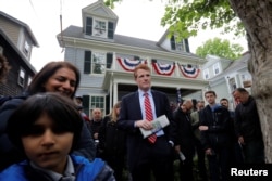 FILE - U.S. Congressman Joe Kennedy III waits to speak at ceremonies on the 100th anniversary of the birth of Congressman Kennedy's great-uncle, U.S. President John F. Kennedy, outside the home where President Kennedy was born, in Brookline, Massachusetts