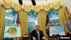 U.S. President Donald Trump holds an Oval Office meeting on preparations for hurricane Florence at the White House in Washington, Sept. 11, 2018.