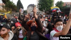 Demonstrators participate in a protest against poverty and police violence, in Bogota, Colombia on May 4, 2021.
