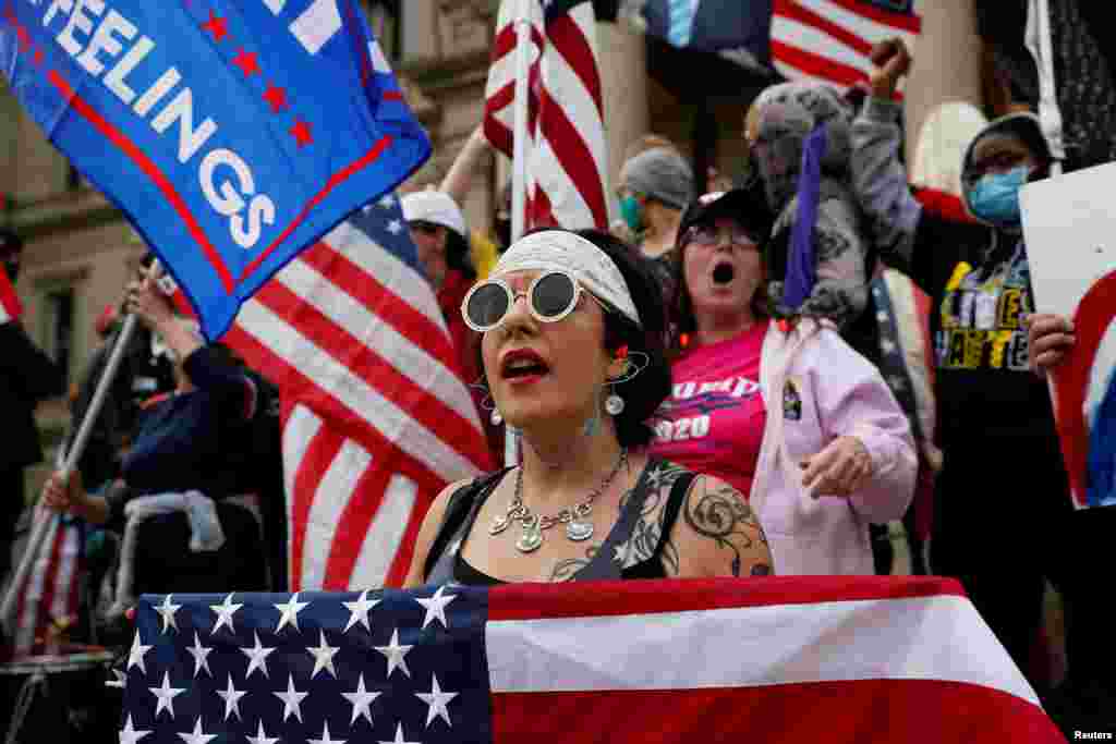 Protesters rally outside the State Capitol building after former Vice President Joe Biden was declared the winner of the 2020 U.S. presidential election, in Lansing, Michigan, Nov. 8, 2020.