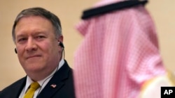 U.S. Secretary of State Mike Pompeo, left, listens to Saudi Arabia's Foreign Minister Adel al-Jubeir, during a joint press conference at the Royal Terminal of King Khaled airport, in Riyadh, Saudi Arabia, Sunday, April 29, 2018. 