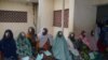 A group of women in Kano, Nigeria, wait to have patches removed from their eyes following cataract surgery. (Isiyaku Ahmed/VOA News) 