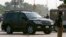 A car carrying former Pakistani President Pervez Musharraf, who is the head of the All Pakistan Muslim League (APML) political party, arrives at an anti-terrorism court in Rawalpindi, August 20, 2013. 