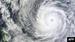 NASA satellite image shows Typhoon Vongfong in the western Pacific Ocean. Typhoon Vongfong is rapidly intensifying and is a dangerous threat to Japan this weekend, Oct. 8, 2014.