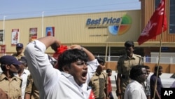 India’s leftist party activists shout slogans during a protest in front of a Bharti Walmart Best Price wholesale store in Hyderabad, India, November 19, 2102.