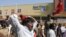 India’s leftist party activists shout slogans during a protest in front of a Bharti Walmart Best Price wholesale store in Hyderabad, India, November 19, 2102.