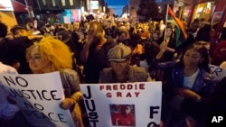 Protesters march after a rally at City Hall in Philadelphia on April 30, 2015.