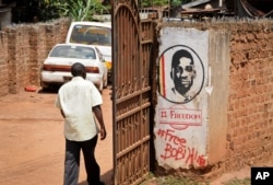 FILE - In this Thursday, Sept. 20, 2018 file photo, graffiti in support of pop star-turned-opposition lawmaker Bobi Wine, in the Kamwokya neighborhood where he has many supporters, in Kampala.